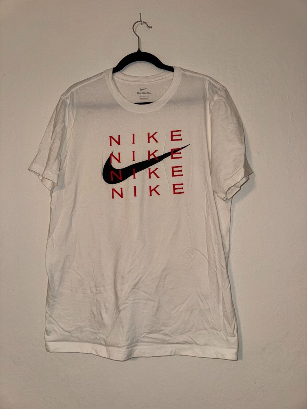 Nike The Nike Tee White Graphic T-Shirt Repeating Red Logo Black Swoosh